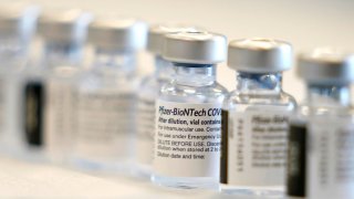 Bottles for the Pfizer BioNTech COVID-19 vaccine are ready to be prepared before the opening of a mass vaccination site in the Queens borough of New York, February 24, 2021.