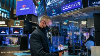 Traders work on the floor of the New York Stock Exchange.