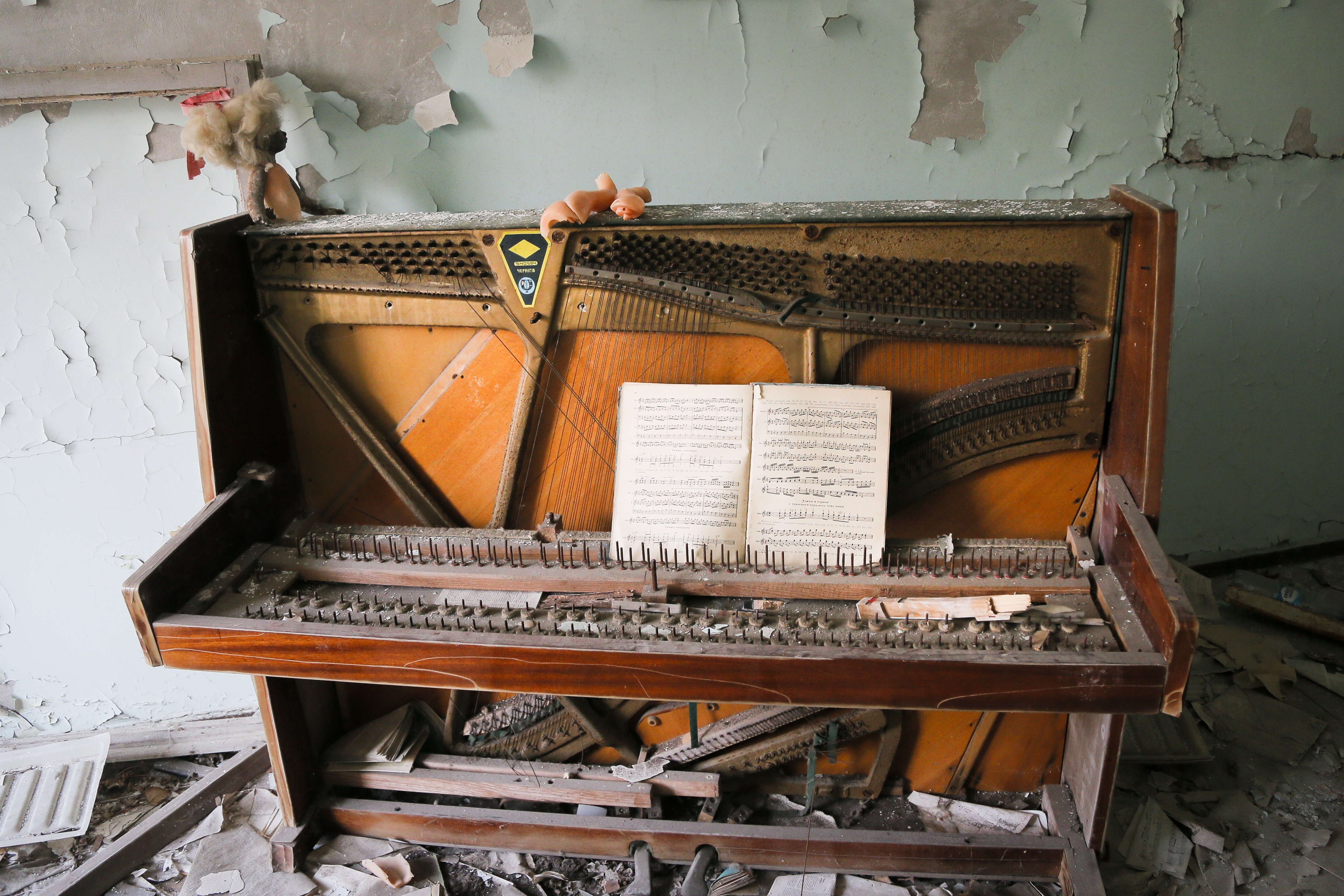A decrepit piano stands in a school in the deserted town of Pripyat,  Ukraine, April 5, 2017. Once home to some 50,000 people whose lives were connected to the Chernobyl nuclear power plant, Pripyat was hastily evacuated one day after a reactor at the plant two miles away exploded on April 26, 1986. The explosion and the subsequent fire spewed a radioactive plume over much of northern Europe.