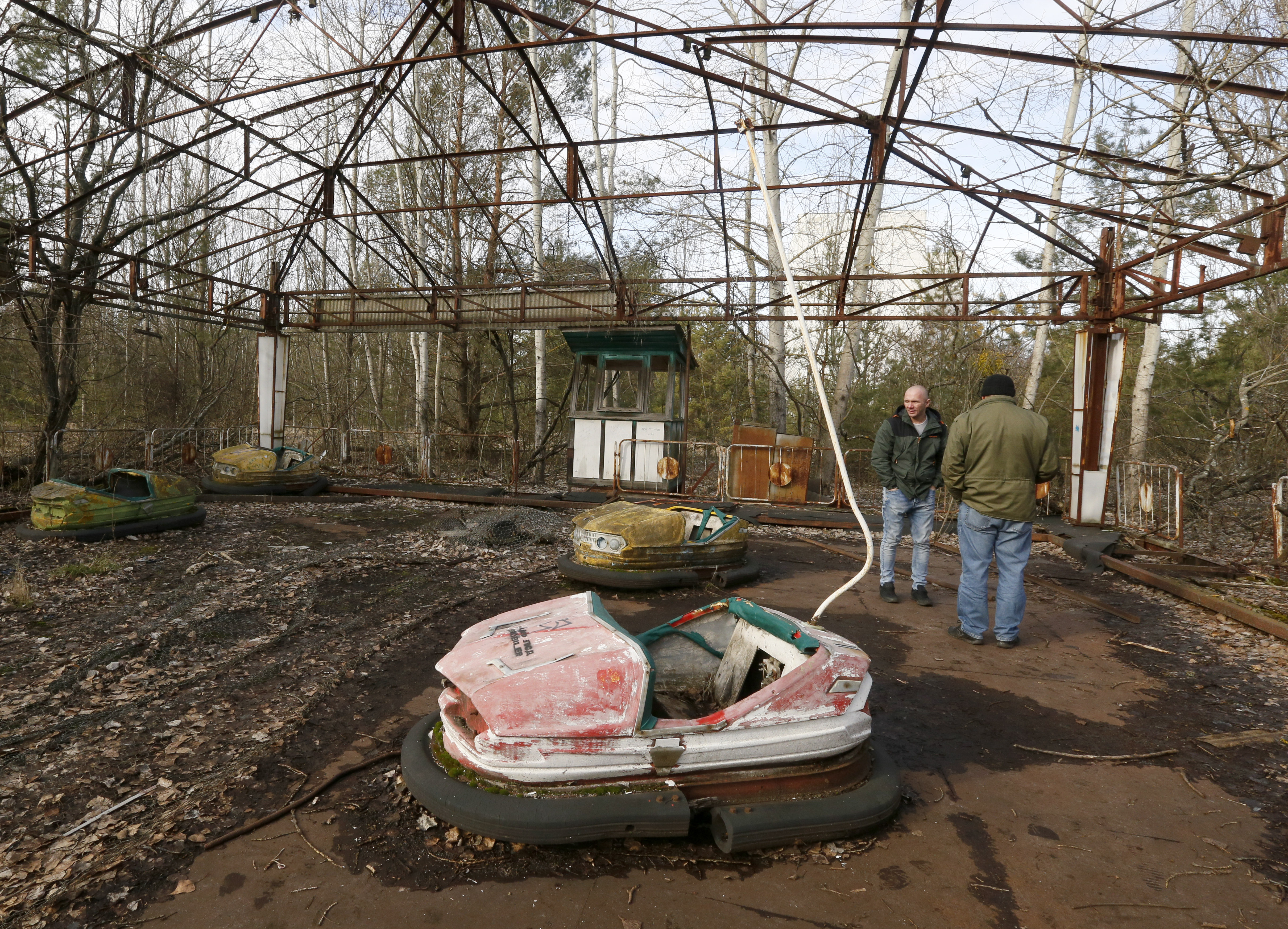 People visit an abandoned amusement park in the abandoned city of Pripyat, Ukraine, Feb. 4, 2020.
