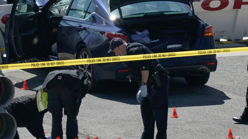 Capitol Police officers investigate near a car that crashed into a barrier on Capitol Hill near the Senate side of the Capitol in Washington, Friday, April 2, 2021.