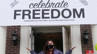 Vicky Chavez celebrates as she steps outside First Unitarian Church for the first time in 1,168 days as church congregants cheered celebrating her newfound freedom Thursday, April 15, 2021, in Salt Lake City. Chavez, a Honduran woman in the U.S. illegally who received sanctuary in a Salt Lake City church with her two young daughters for more than three years is now free to leave without risk of deportation.