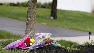 Flowers lay in a makeshift memorial