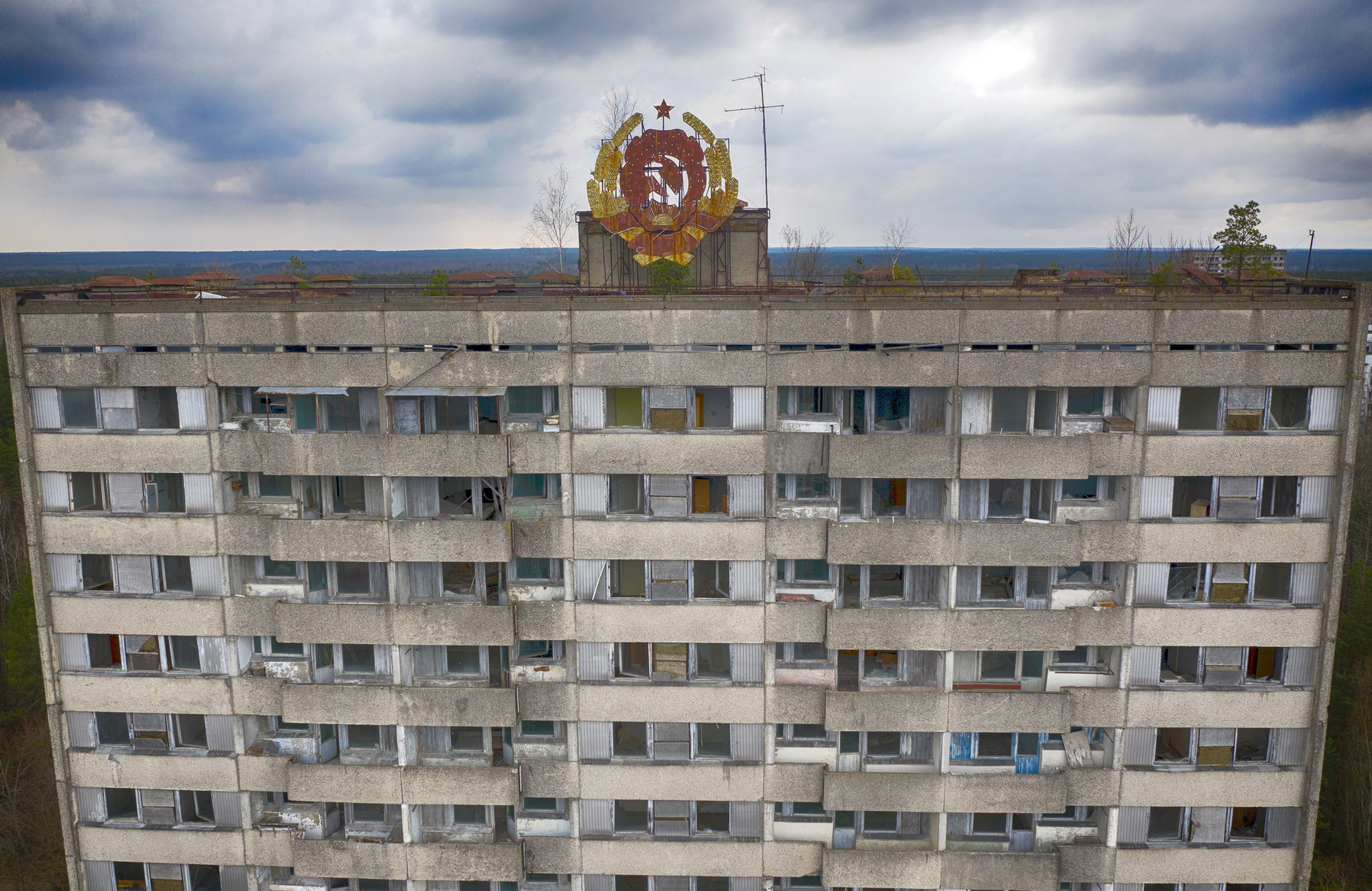 The rusty emblem of the Soviet Union is seen over Pripyat close to the Chernobyl nuclear plant, Ukraine, April 15, 2021.