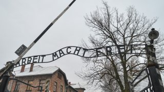 A general view of the sign ‘Arbeit Macht Frei’ over the main entrance gate to Auschwitz.