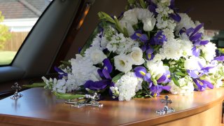 A coffin inside a hearse