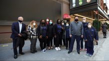 Healthcare workers and Jordan Strohl (3rd right) from The Actors Fund Home pose for a photo as Broadway's St. James Theatre reopens with an exclusive performance for frontline workers as part of NY PopsUp