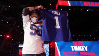 Giants Fan holding Kadarius Toney jersey