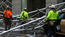 Crews clear scaffolding on a Midtown block after a driver crashed into the structure