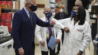 U.S. President Joe Biden greets Kizzmekia Corbett and Anthony Fauci at the National Institutes of Health in February