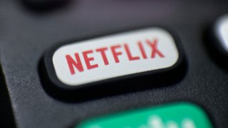 a logo for Netflix on a remote control