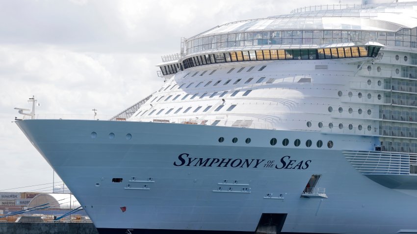 FILE - The Symphony of the Seas cruise ship is shown docked at PortMiami, in a Wednesday, May 20, 2020, file photo, in Miami. Cruise lines can soon begin trial voyages in U.S. waters. They'll have to carry some volunteer passengers, who will have to wear face masks and observe social distancing while on board. The Centers for Disease Control and Prevention gave ship operators final technical guidelines Wednesday, May 5, 2021 for the trial runs.