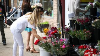 People buy flowers in Hoboken of New Jersey, United States on May 9, 2021 as Mother's Day is celebrated cross country.