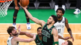 Jaysome Tatum scores a basket