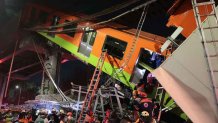 MEXICO CITY, MEXICO - MAY 03: Emergency personnel work to search for accident survivors after a raised subway track collapsed on May 03, 2021 in Mexico City, Mexico. The Line 12 accident happened between Olivos and Tezonco Metro stations. (Photo by Hector Vivas/Getty Images)