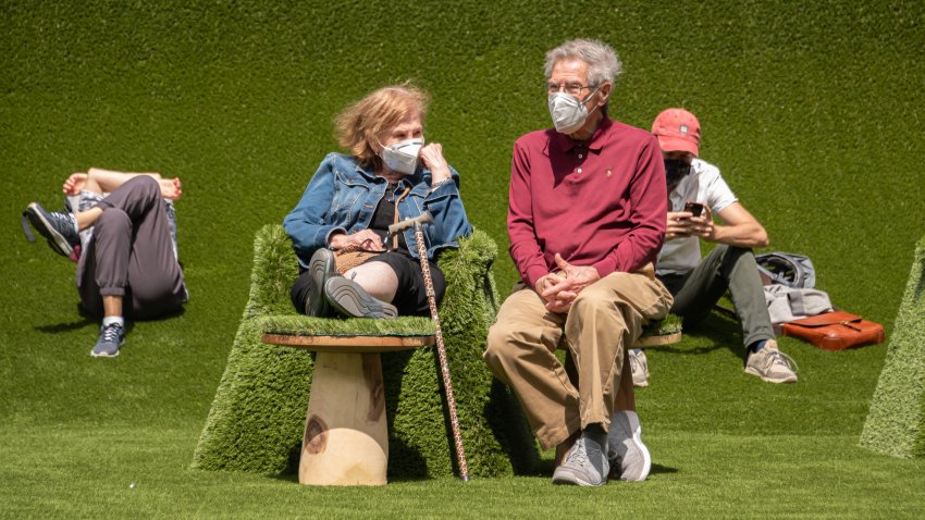 People sit at 'The Green' in Lincoln Center for the Performing Arts on May 11, 2021 in New York City