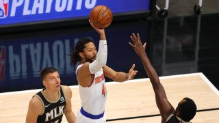 Taj Gibson #67 of the New York Knicks steals the ball from Bogdan Bogdanovic #13 of the Atlanta Hawks