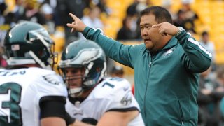 PITTSBURGH, PA - OCTOBER 7: Offensive line assistant Eugene Chung of the Philadelphia Eagles directs players during pregame warmup prior to a game against the Pittsburgh Steelers at Heinz Field on October 7, 2012 in Pittsburgh, Pennsylvania. The Steelers defeated the Eagles 16-14.