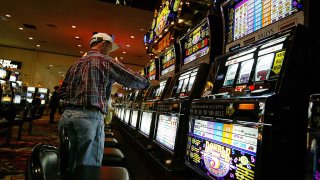 A man plays slot machines in Atlantic City, New Jersey, casino.