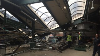 A NJ Transit train seen through the wreckage after it crashed in to the platform at the Hoboken Terminal September 29, 2016 in Hoboken, New Jersey