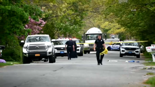 Police in Suffolk County tape off a residential street after the death of a 3-year-old boy struck by a pickup truck pulling out of a driveway.