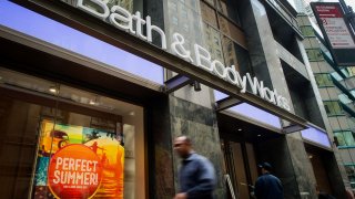 Pedestrians walk past a Bath & Body Works store.