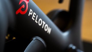 A Peloton Interactive Inc. logo on a stationary bike at the company’s showroom in Dedham, Massachusetts, U.S., on Wednesday, Feb. 3, 2021.