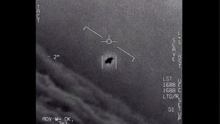 The image from video provided by the Department of Defense labelled Gimbal, from 2015, an unexplained object is seen at center as it is tracked as it soars high along the clouds, traveling against the wind.