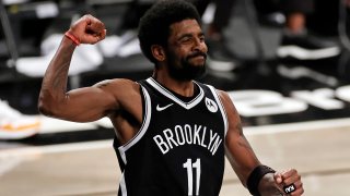 Brooklyn Nets guard Kyrie Irving reacts during the second half of Game 1 of the team's NBA basketball second-round playoff series against the Milwaukee Bucks on Saturday, June 5, 2021, in New York. The Nets won 115-107. (AP Photo/Adam Hunger)