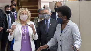 First Lady Dr. Jill Biden (L) and Dr. Anthony Fauci (C), Director of the National Institute of Allergy and Infectious Diseases, speak with members of the Abyssinian Baptist Church on June 6, 2021 in New York City