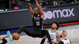 Nicolas Claxton slam dunks