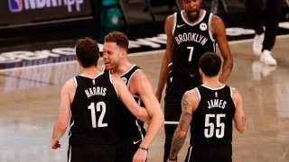 The Brooklyn Nets celebrate during the fourth quarter against the Milwaukee Bucks during Game One of the Eastern Conference second round series at Barclays Center on June 05, 2021 in New York City