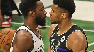 Nets and bucks players stare down each other