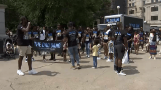 Families march in Brooklyn for the second annual "March of Dads."