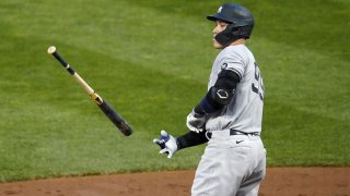 Aaron Judge tosses a bat