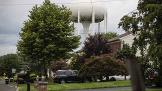 a water tower stands above a residential neighborhood in Horsham, Pa.