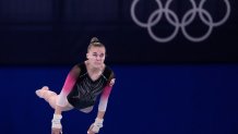 Hanna Traukova, of Belarus, performs on the vault during the women's artistic gymnastic qualifications at the 2020 Summer Olympics, Sunday, July 25, 2021, in Tokyo.