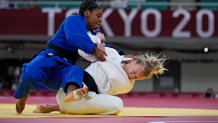 Jessica Klimkait of Canada, right, and Sarah Léonie Cystique of France compete during their women's -57kg judo semifinal match, at the 2020 Summer Olympics in Tokyo, Japan, Monday, July 26, 2021.
