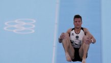 Philipp Herder, of Germany, performs on the vault during the artistic gymnastic men's team final at the 2020 Summer Olympics, Monday, July 26, 2021, in Tokyo.