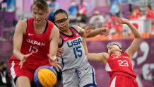 Japan's Risa Nishioka, left, and United States' Allisha Gray, center, chase a loose ball as Japan's Mai Yamamoto (23) falls during a women's 3-on-3 basketball game at the 2020 Summer Olympics, Tuesday, July 27, 2021, in Tokyo, Japan.