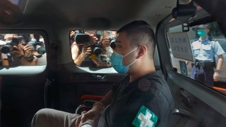 Tong Ying-kit, 23 years old, arrives at a court for the violation of the new security law after carrying a flag reading "Liberate Hong Kong, Revolution of our times" during a protest in Hong Kong