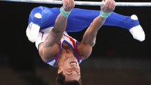 Artur Dalaloyan performs his horizontal bar routine