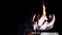 Naomi Osaka of Team Japan carries the Olympic torch to the Olympic cauldron during the Opening Ceremony of the Tokyo 2020 Olympic Games at Olympic Stadium on July 23, 2021 in Tokyo, Japan.