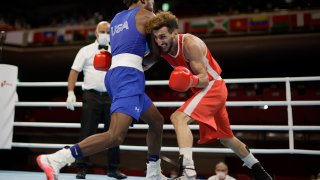 U.S. boxer Keyshawn Davis advances through Round of 16 via TKO of France's Sofiane Oumiha. 