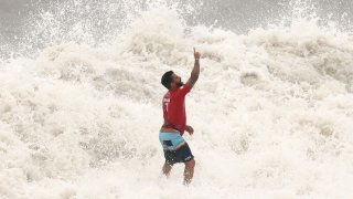 Italo Ferreira celebrates surfing victory