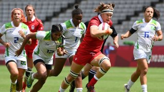 Canada's Karen Paquin runs with the ball during the women's pool B rugby sevens match between Canada and Brazil during the Tokyo 2020 Olympics