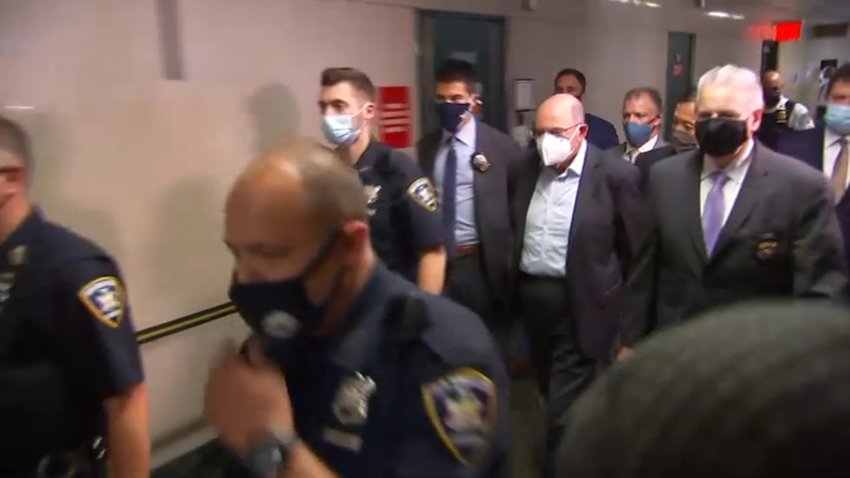 Allen Weisselberg in handcuffs