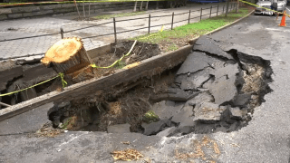 A sinkhole on a Manhattan street collapsed under two parked cars Sunday, prompting renewed criticism of the city’s infrastructure