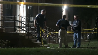 Officers investigate the scene of a shooting on Staten Island where police shot a man.