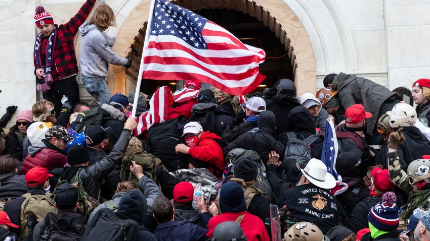 Rioters clash with police trying to enter Capitol building through the front doors, January 6, 2021.